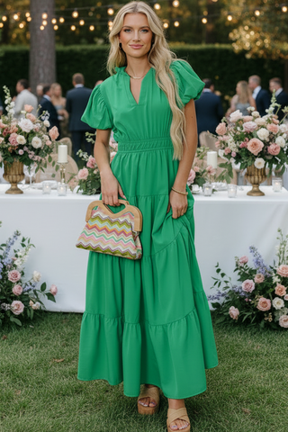 Woman wearing green maxi dress with puff sleeves