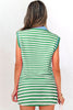 Woman wearing a green and white striped dress on a white background