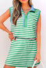 Woman wearing a green and white striped dress with a white background