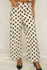 White pants with black polka dots