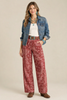 Paisley print pants with turquoise accessories 