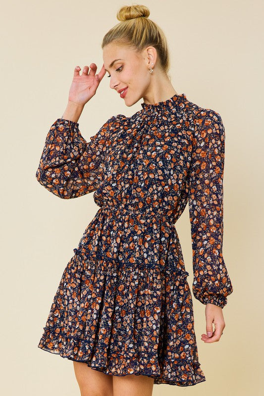 Long sleeved floral dress with tiered skirt